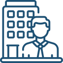 Simple line icon depicting a person in front of a building, symbolising a professional or business setting. The illustration represents concepts related to corporate work or office environments.